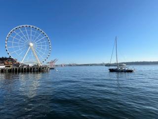 View of a ferris wheel and boat on seaport