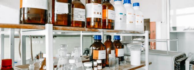Shelves with chemicals in bottles