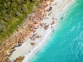 Birdseye view of Western Australia coastal beach ocean and land.